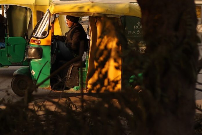 An_auto_rickshaw_on_the_road_of_Delhi_India