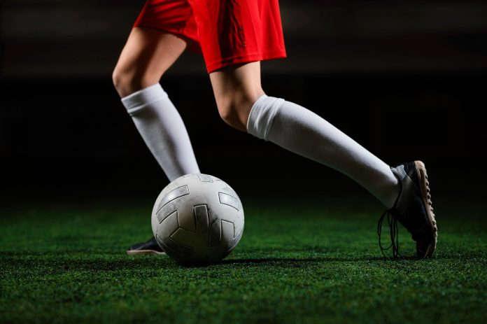 female-football-player-running-ball-1